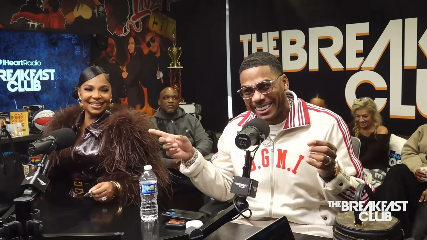 Nelly and Ashanti sitting in the studio during an interview on The Breakfast Club.