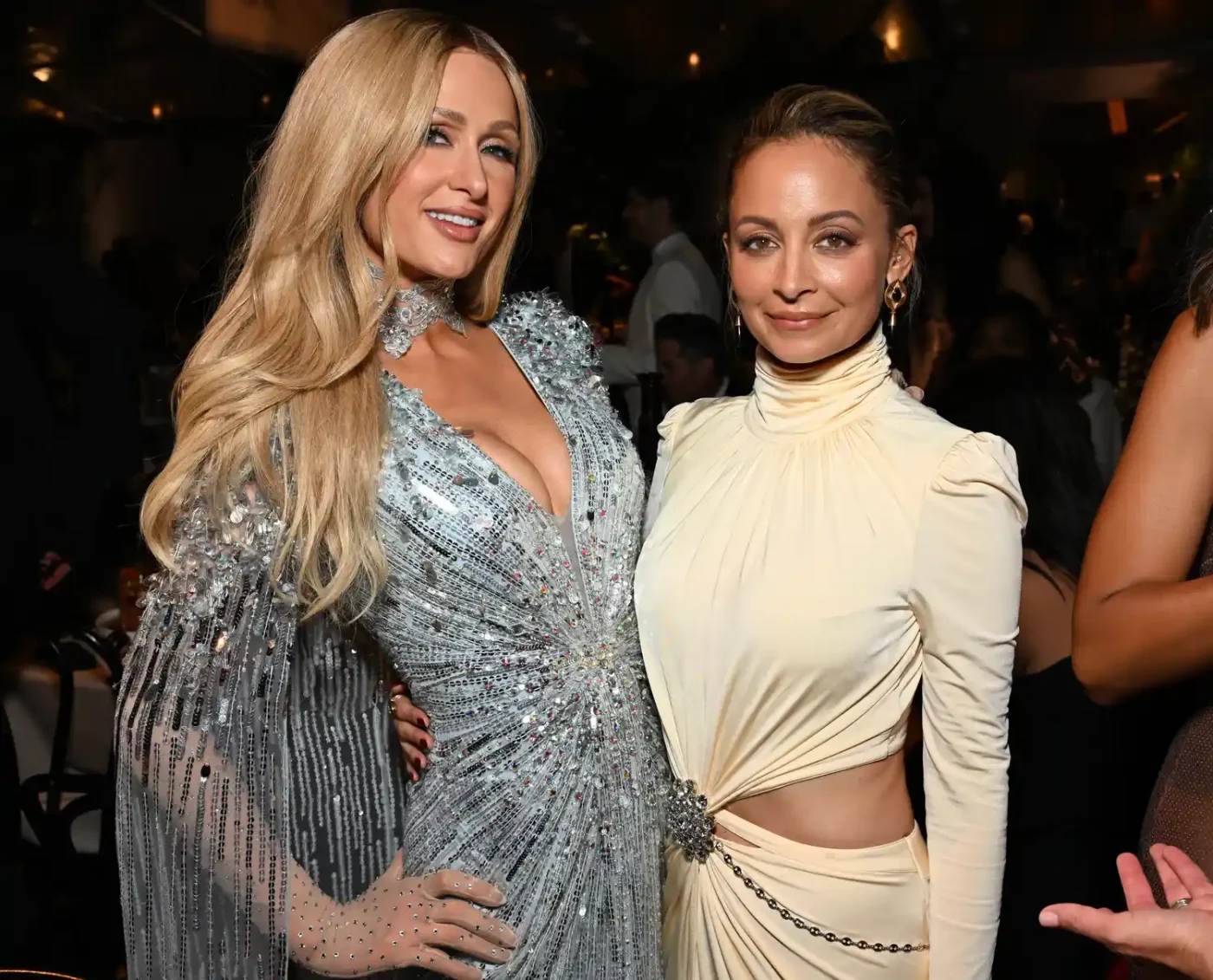 Nicole Richie and Paris Hilton posing together at an event