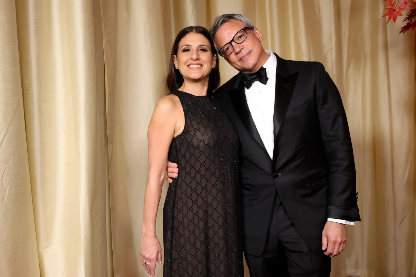 Pamela Abdy and Michael De Luca posing together on the red carpet.