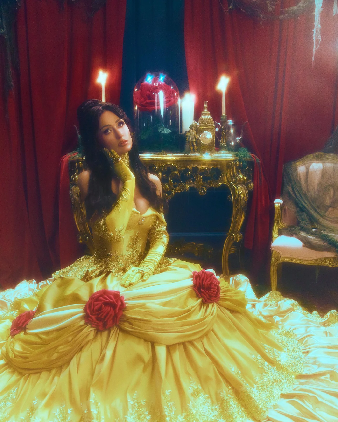 Paris Hilton dressed as Belle from Beauty and the Beast in a yellow gown with red roses in a themed room.