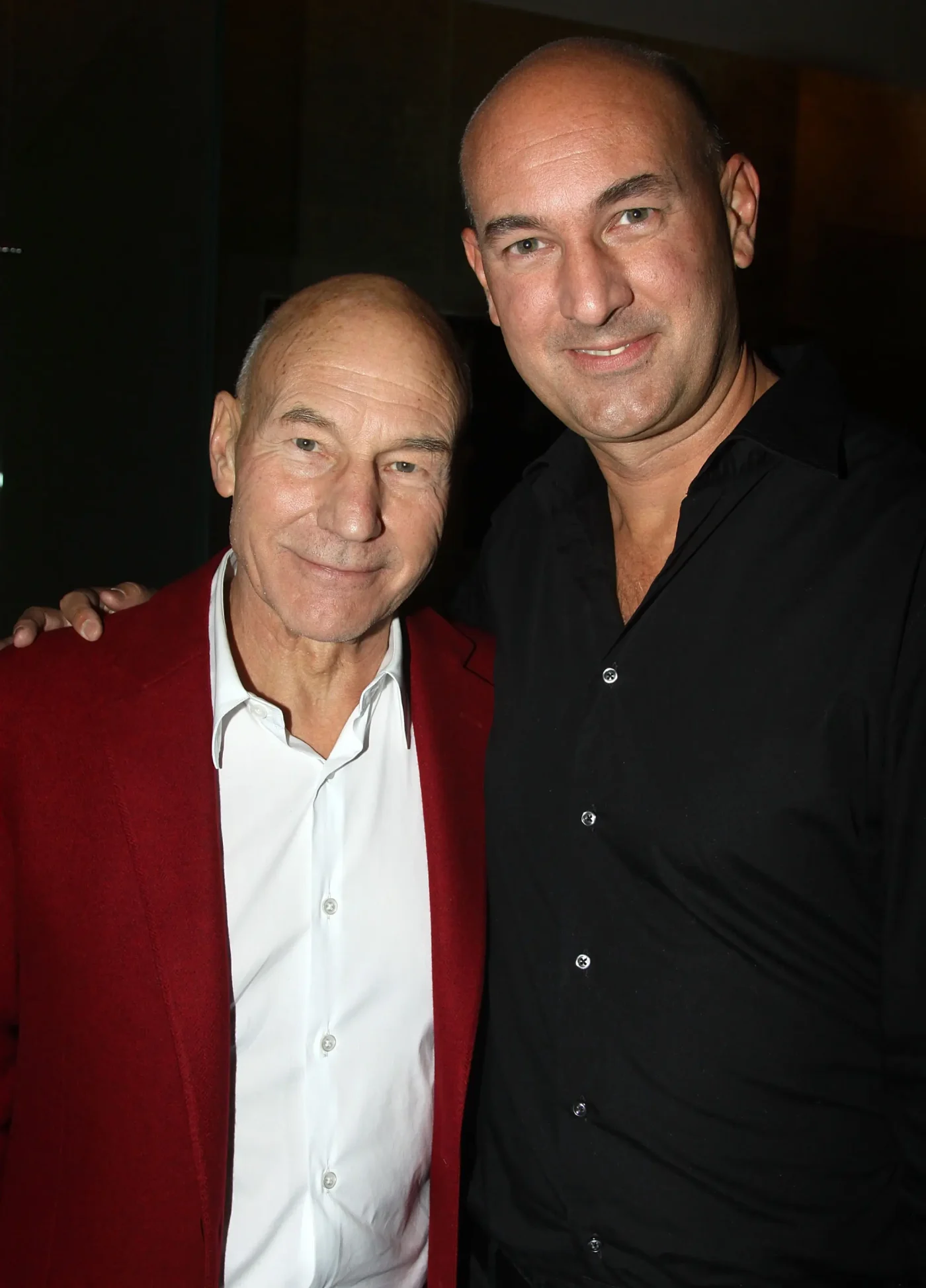 Patrick Stewart and son Daniel Freedom Stewart posing together.