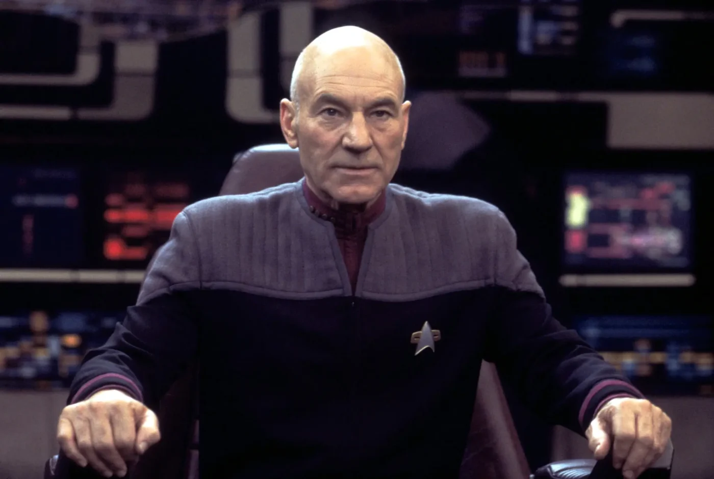Patrick Stewart as Captain Jean-Luc Picard on the bridge of the USS Enterprise in Star Trek: Nemesis.