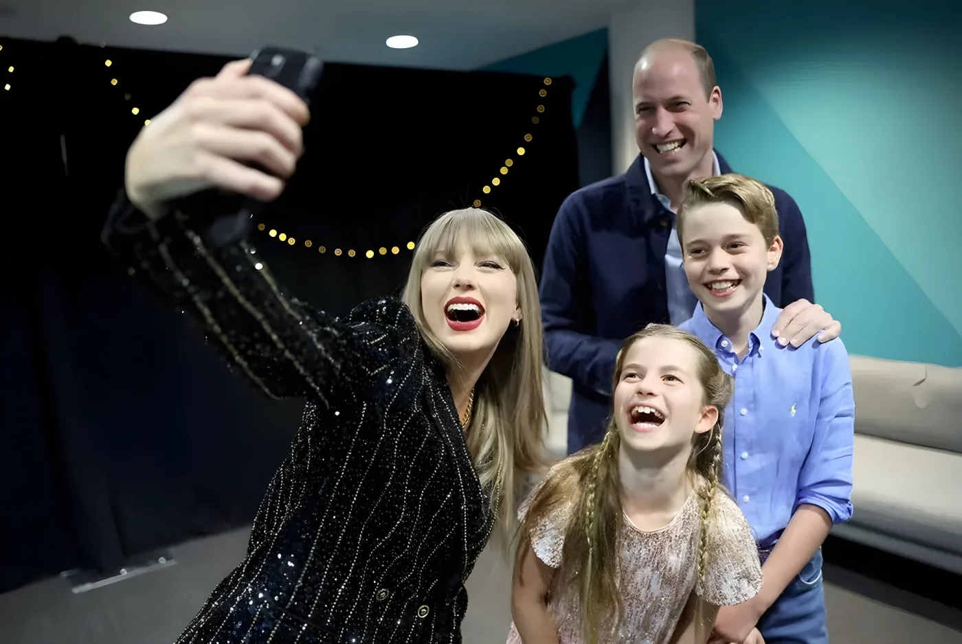 Picture of Taylor Swift taking a selfie with Prince William, Princess Charlotte and Prince George