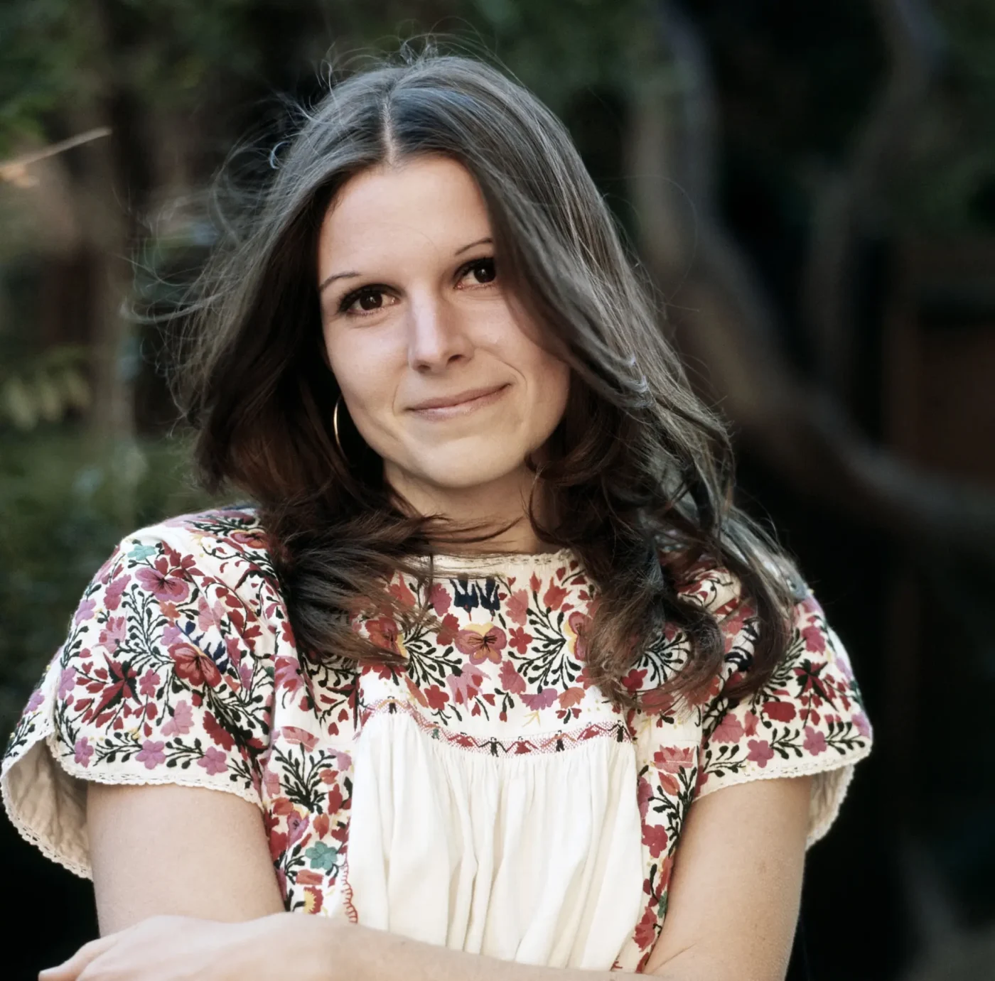Portrait of Susan Saint James wearing an embroidered peasant blouse.