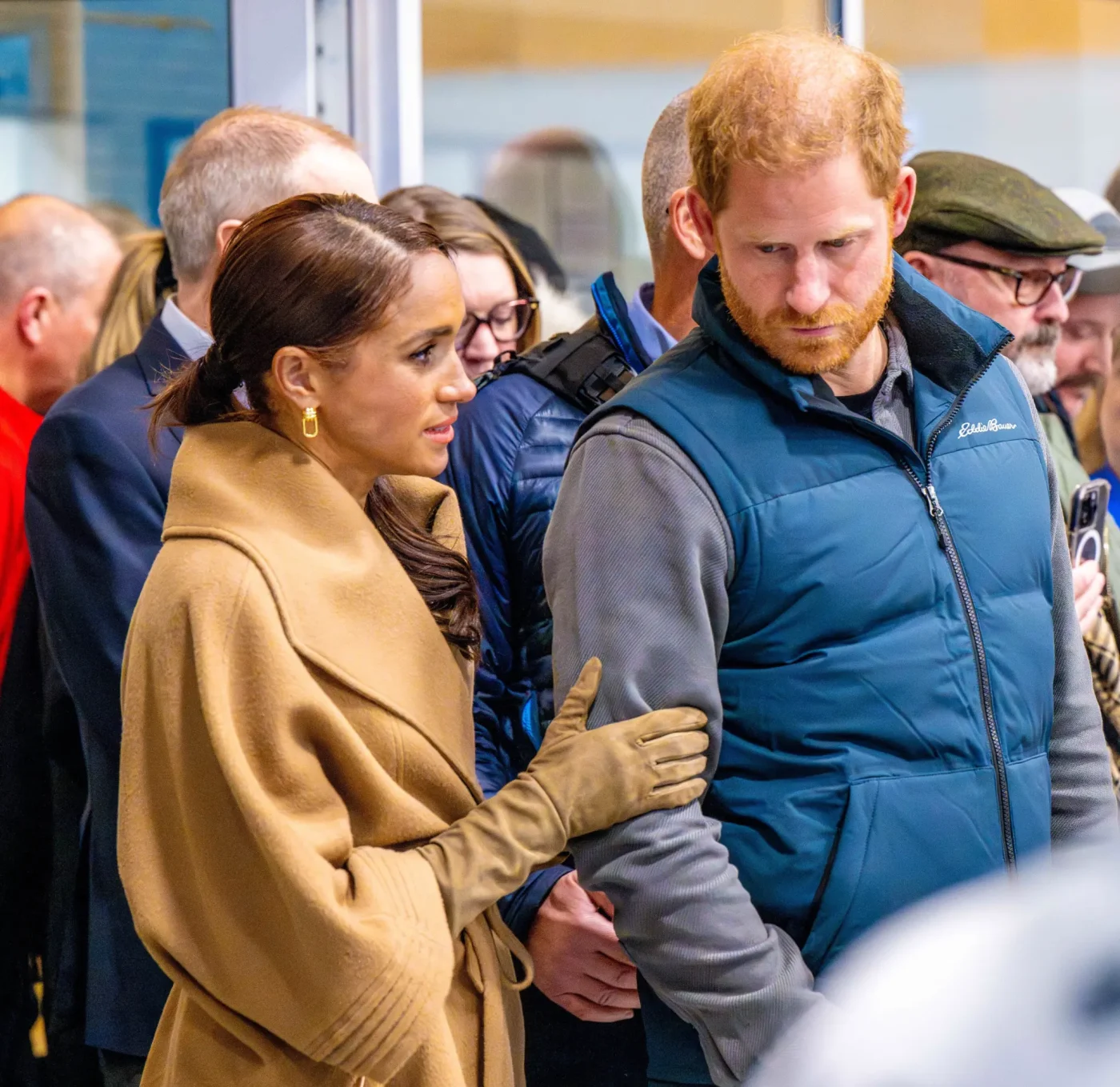 Prince Harry and Meghan Markle in a crowd.