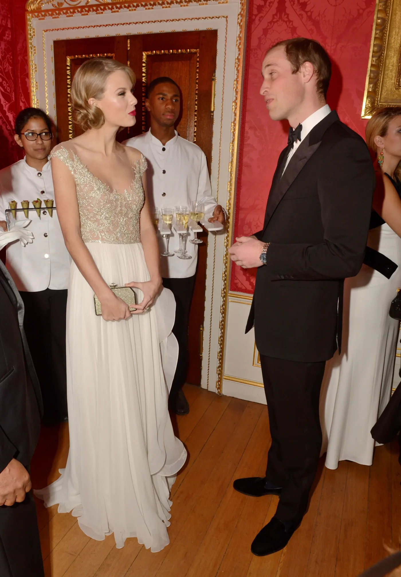 Prince William, Duke of Cambridge meets singer Taylor Swift at Kensington Palace for the Centrepoint Winter Whites Gala on November 26, 2013 in London, England