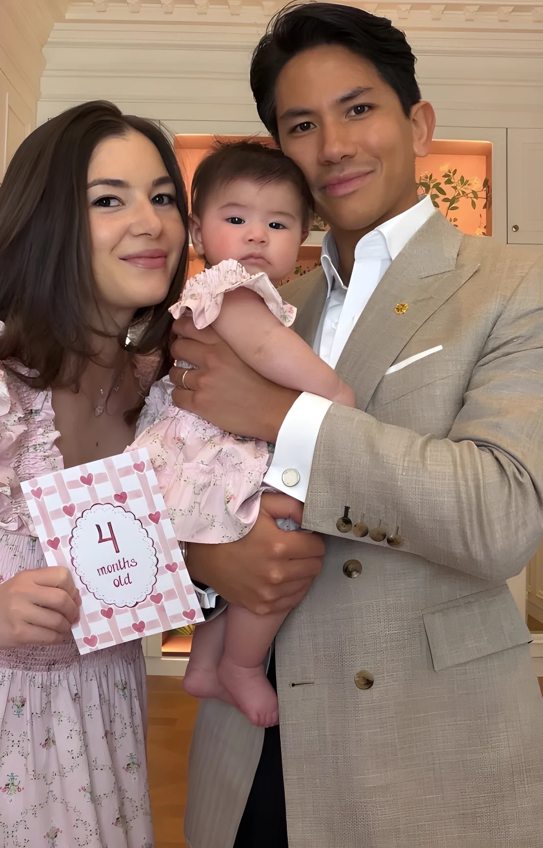Princess Anisha Rosnah and Prince Mateen holding their daughter Princess Zahra, who wore a pink dressed