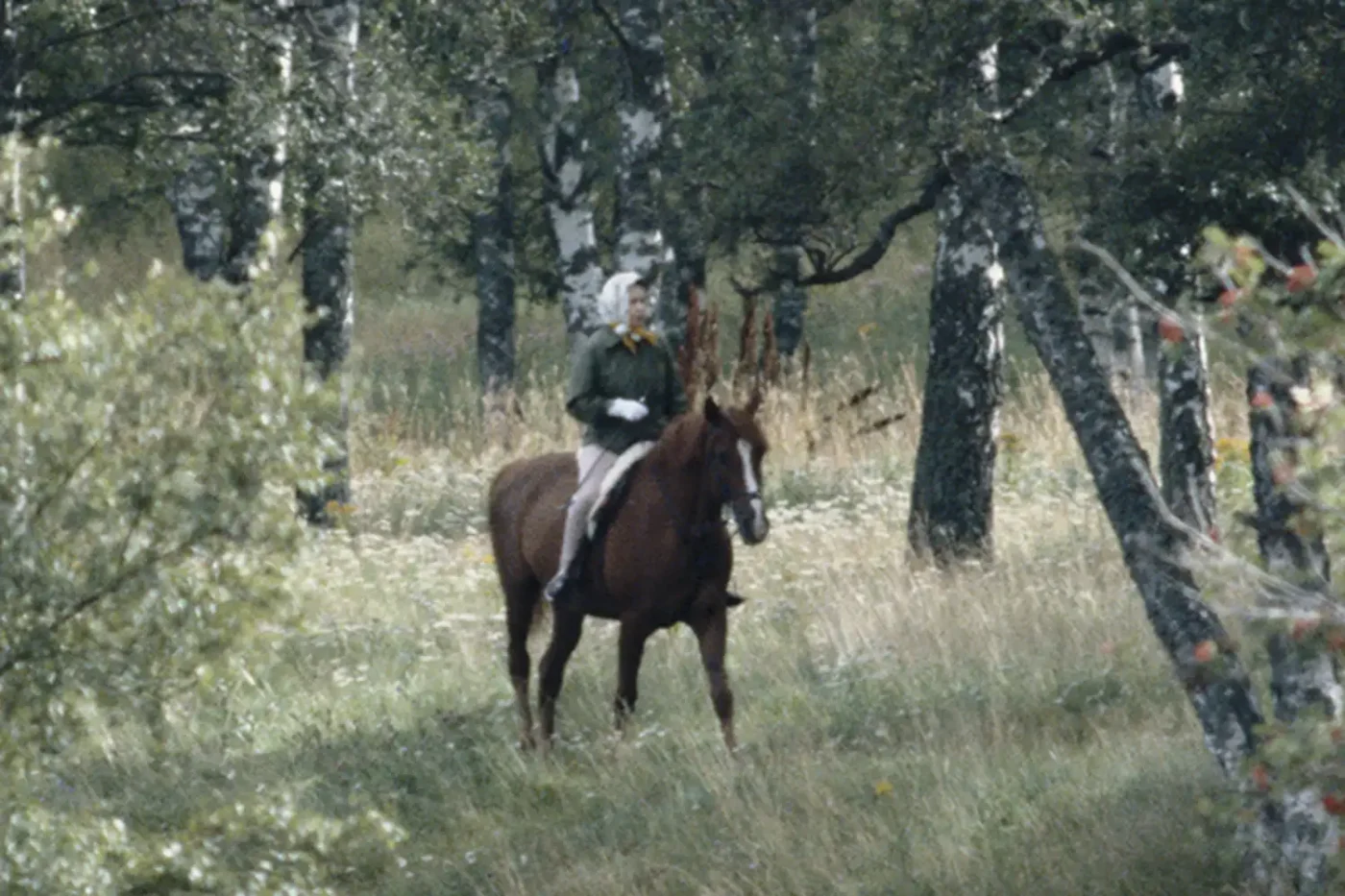 Queen Elizabeth II horse riding on the Balmoral estate