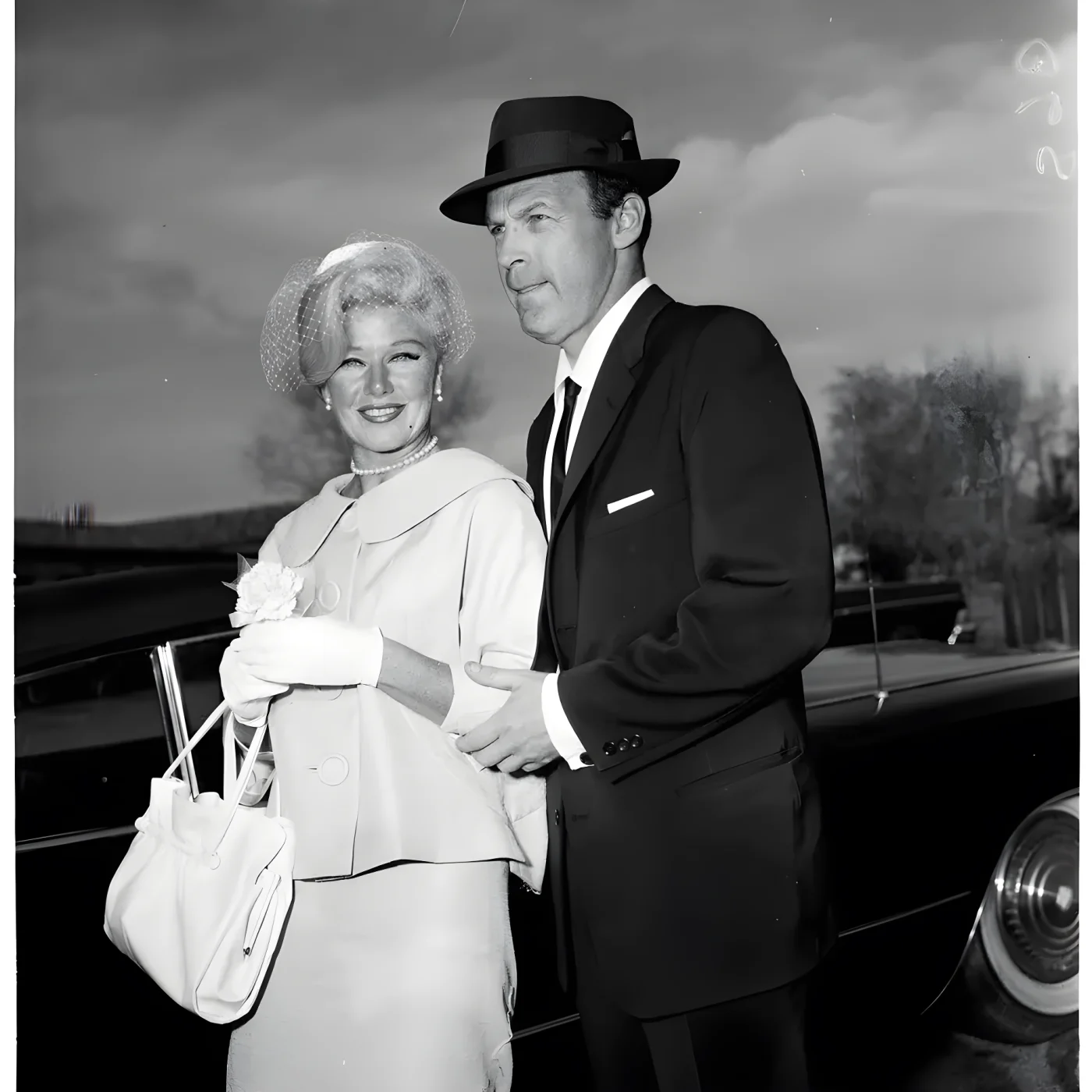 Rogers - Marshall wedding, 16 March 1961. Ginger Rogers (bride); William Marshall (groom); Michael Marshall (best man); Mrs Duke Parkening (matron of honor); Caption slip reads: 'Photographer: Snow. Date: 1961-03-16. Reporter: Farrell. Assignment: Ginger Rogers. Ginger Rogers and new husband, William Marshall. Rogers, Marshall, and his son Michael, best man, and his sister, Mrs Duke Parkening, matron of honor '.