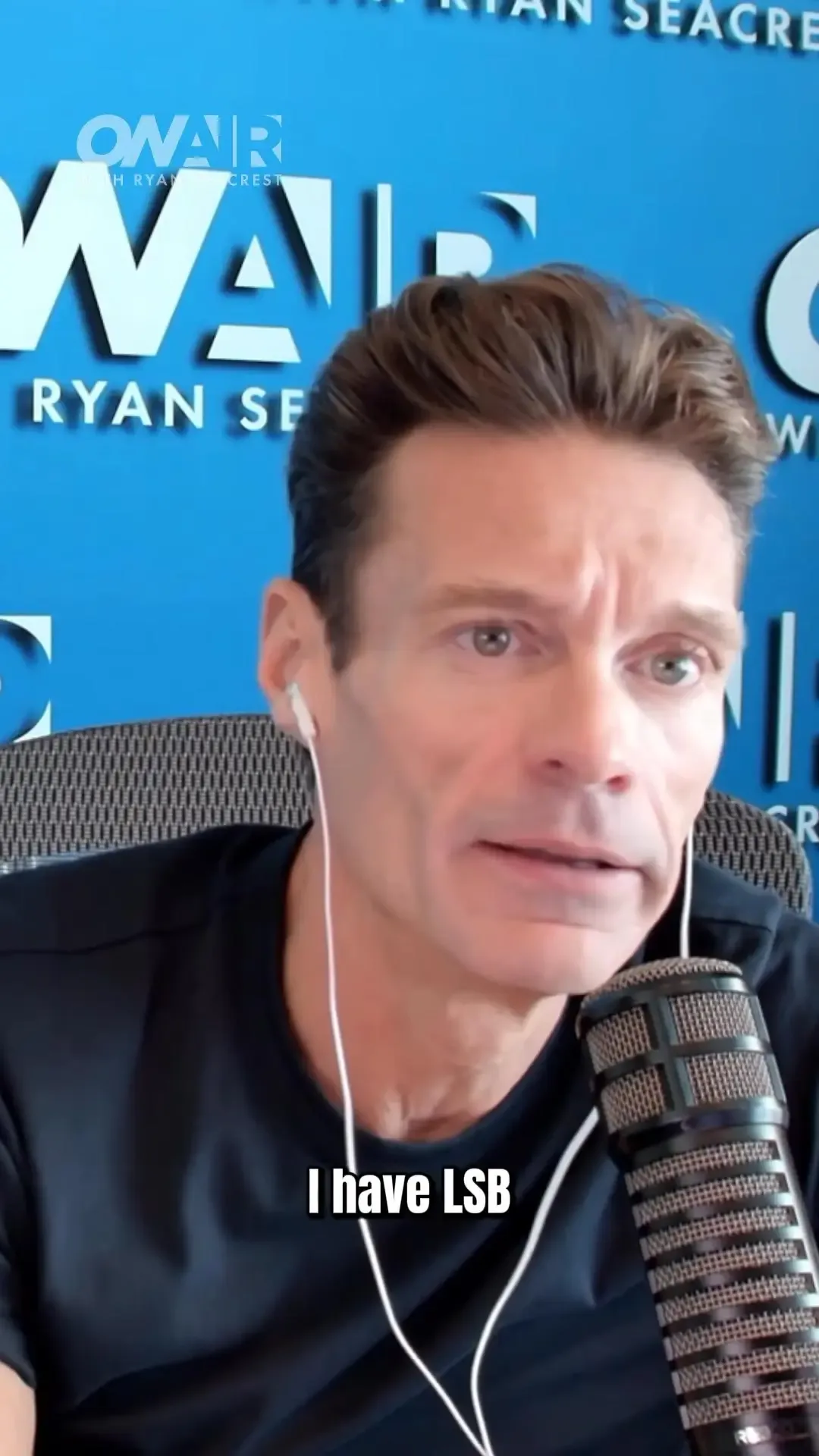 Ryan Seacrest speaking into a microphone with the caption