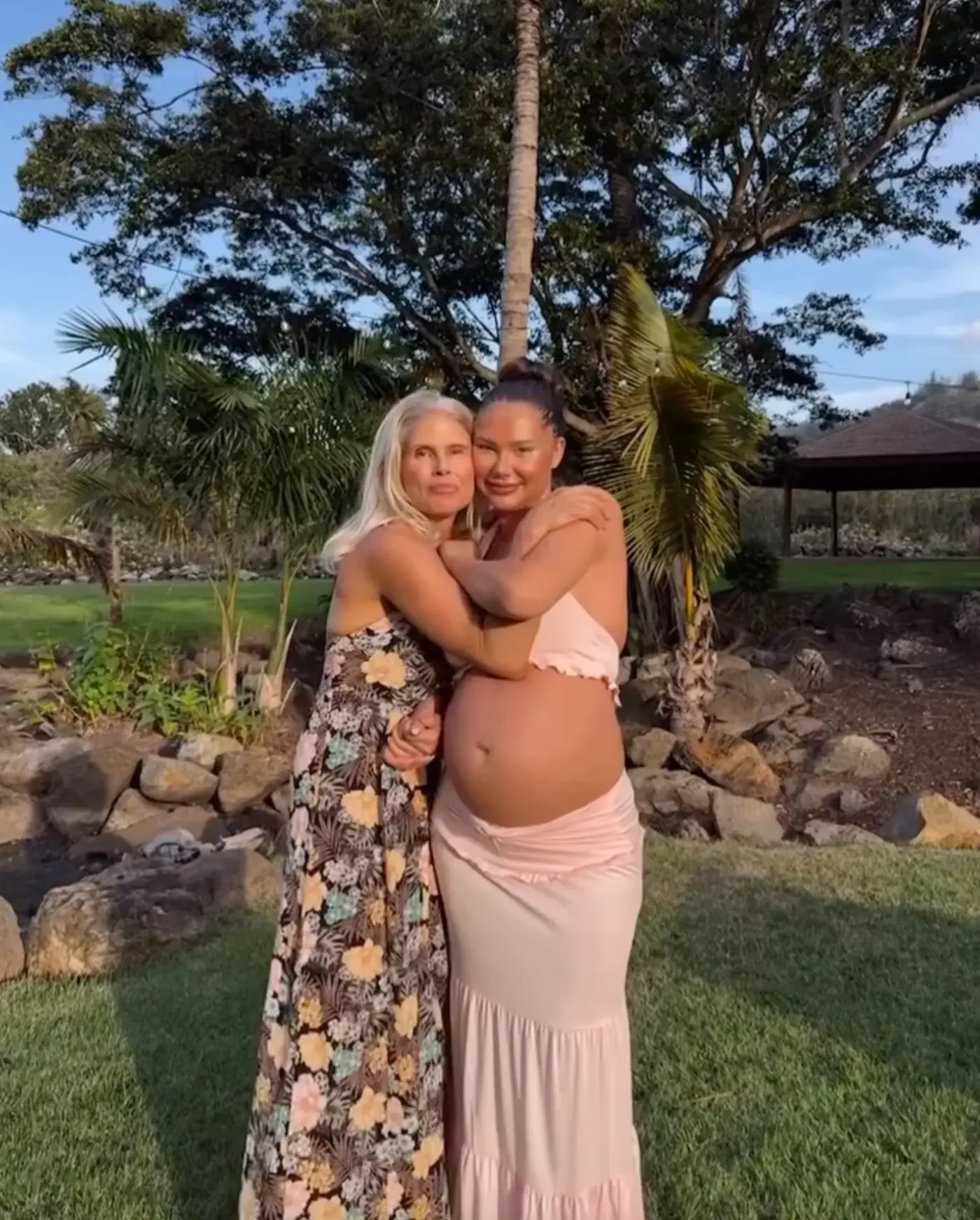 Sahara Ray embracing her mother outdoors.