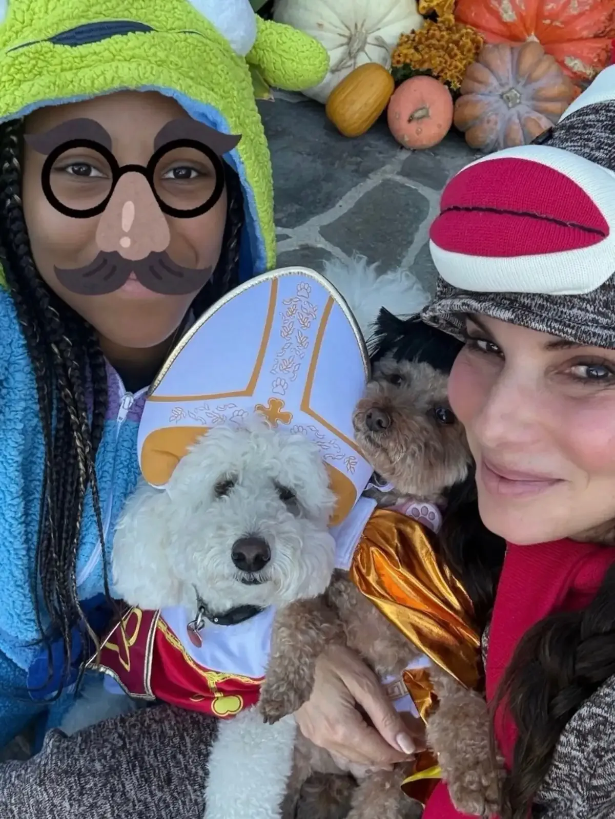 Sandra Bullock with daughter Laila Bullock, alongside their dogs in Halloween Throwback Post