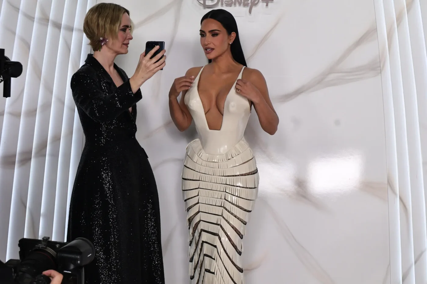 Sarah Paulson takes a photo of Kim Kardashian at a presentation for the Disney Hulu series