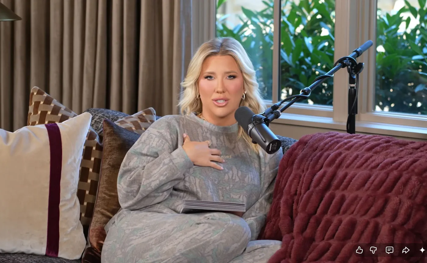 Savannah Chrisley sitting on a couch in a studio, speaking into a microphone.