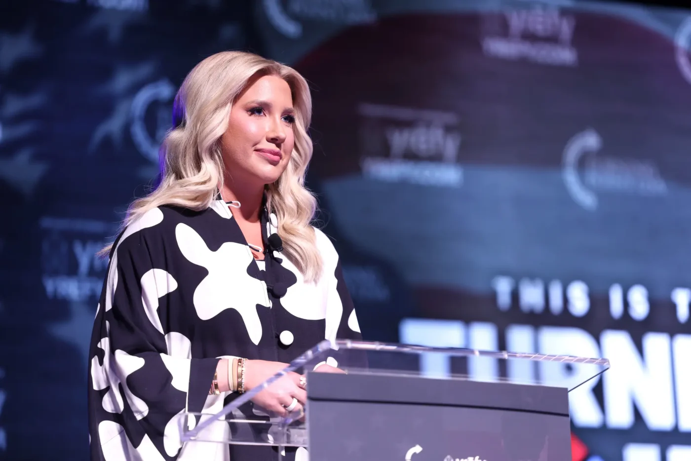 Savannah Chrisley speaking at a podium at The Ohio State University.
