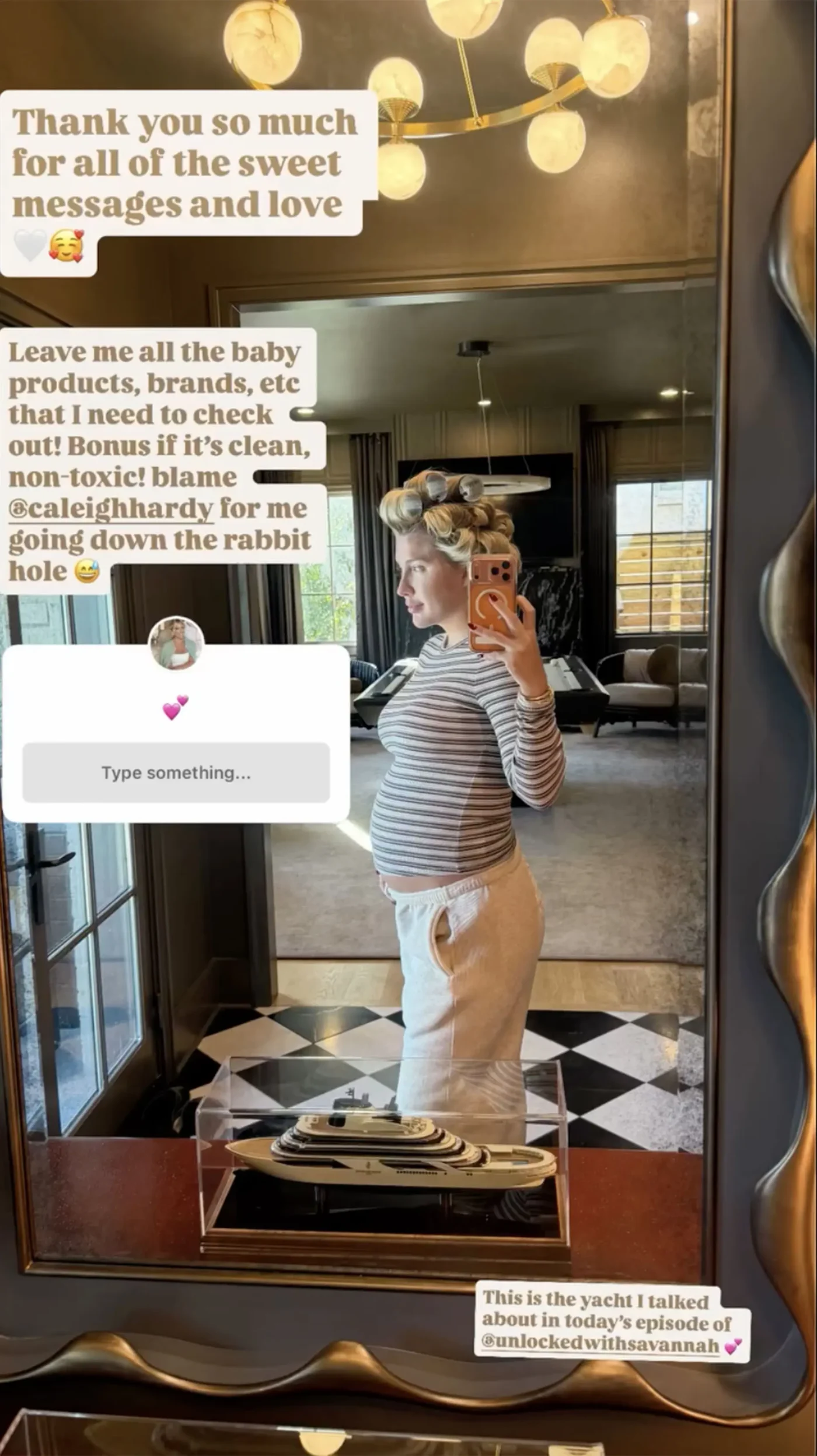 Savannah Chrisley takes a mirror selfie showing her pregnant belly while wearing hair rollers, a striped shirt, and sweatpants.