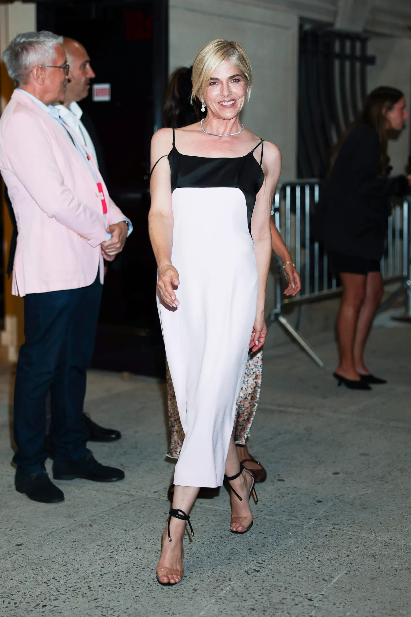 Selma Blair wearing a black and white slip dress.