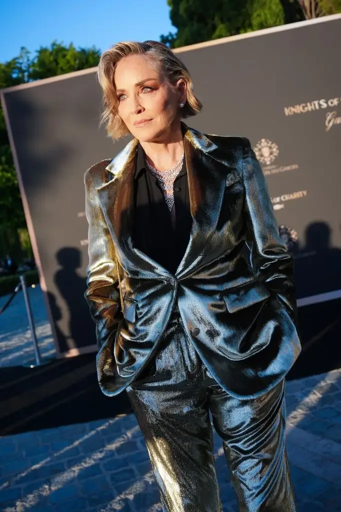 Sharon Stone in metallic suit attends the Knights of Charity gala during the 79th annual Cannes Film Festival