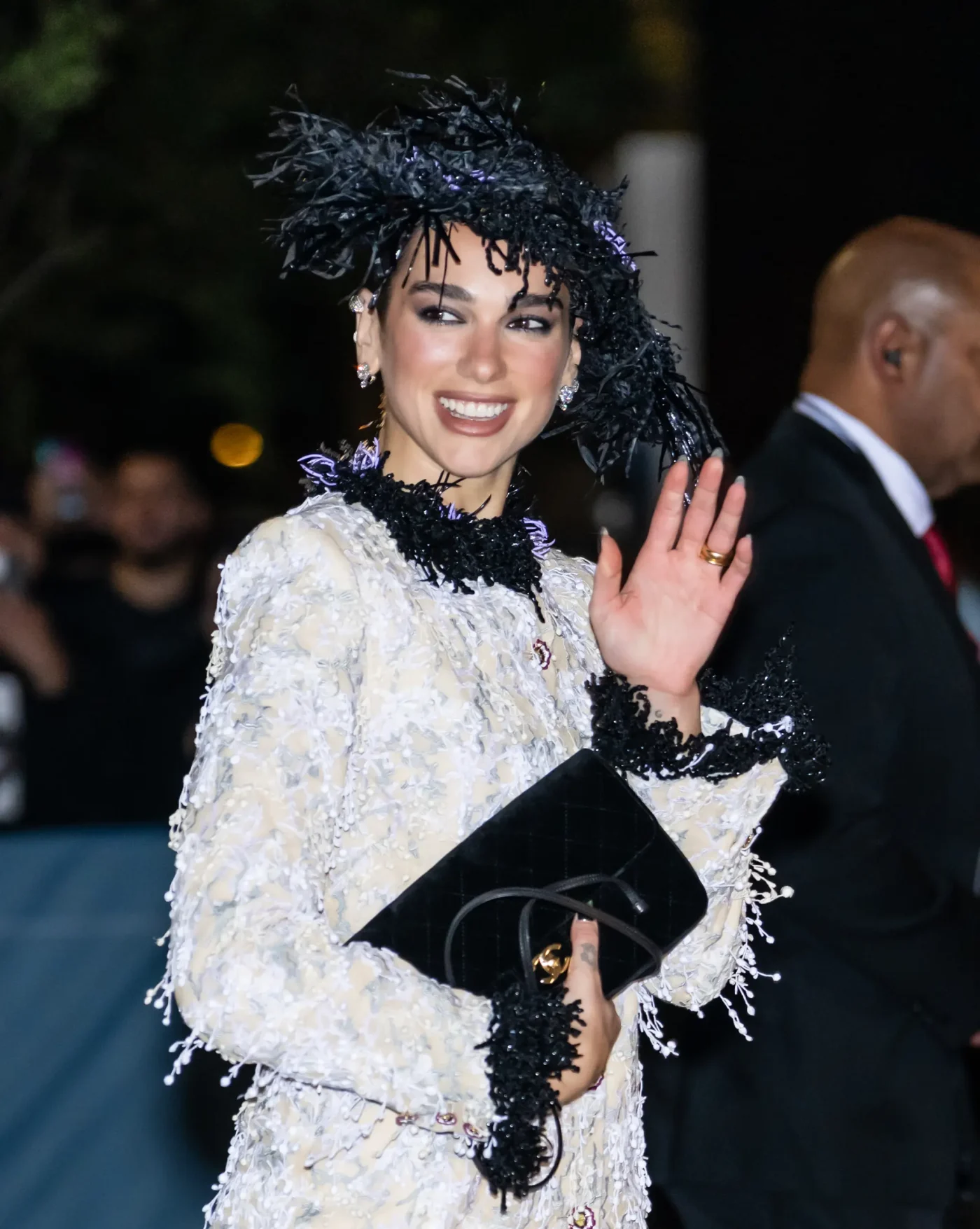 Singer Dua Lipa waves while attending an awards event in New York City.