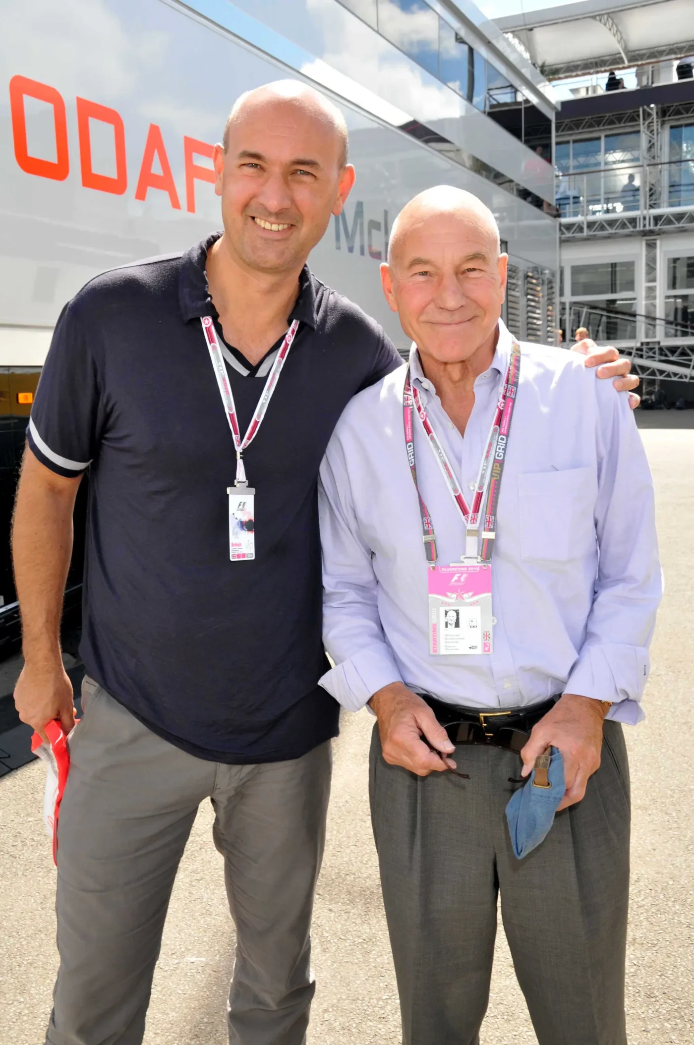 Sir Patrick Stewart posing with his son, Daniel Stewart, at the British Grand Prix.