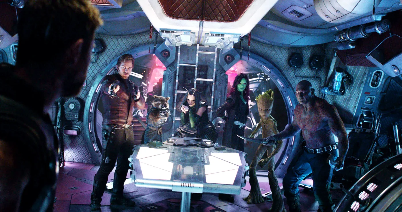 Star-Lord, Rocket, Mantis, Gamora, Groot, and Drax from the Guardians of the Galaxy stand on a spaceship facing Thor.