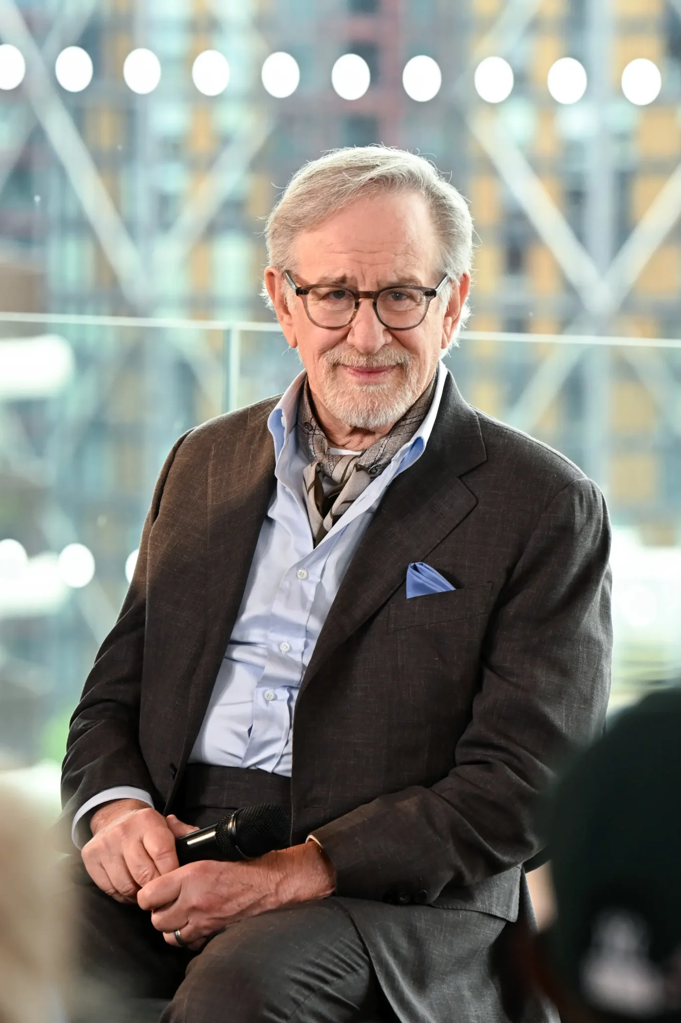 Steven Spielberg sitting with a microphone during a Q&A event.