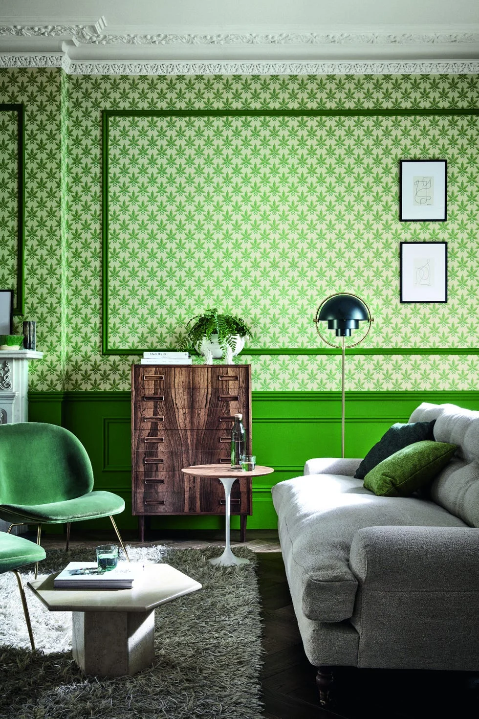 stylish modern living room with green wallpaper, gray sofa, and wooden furniture.