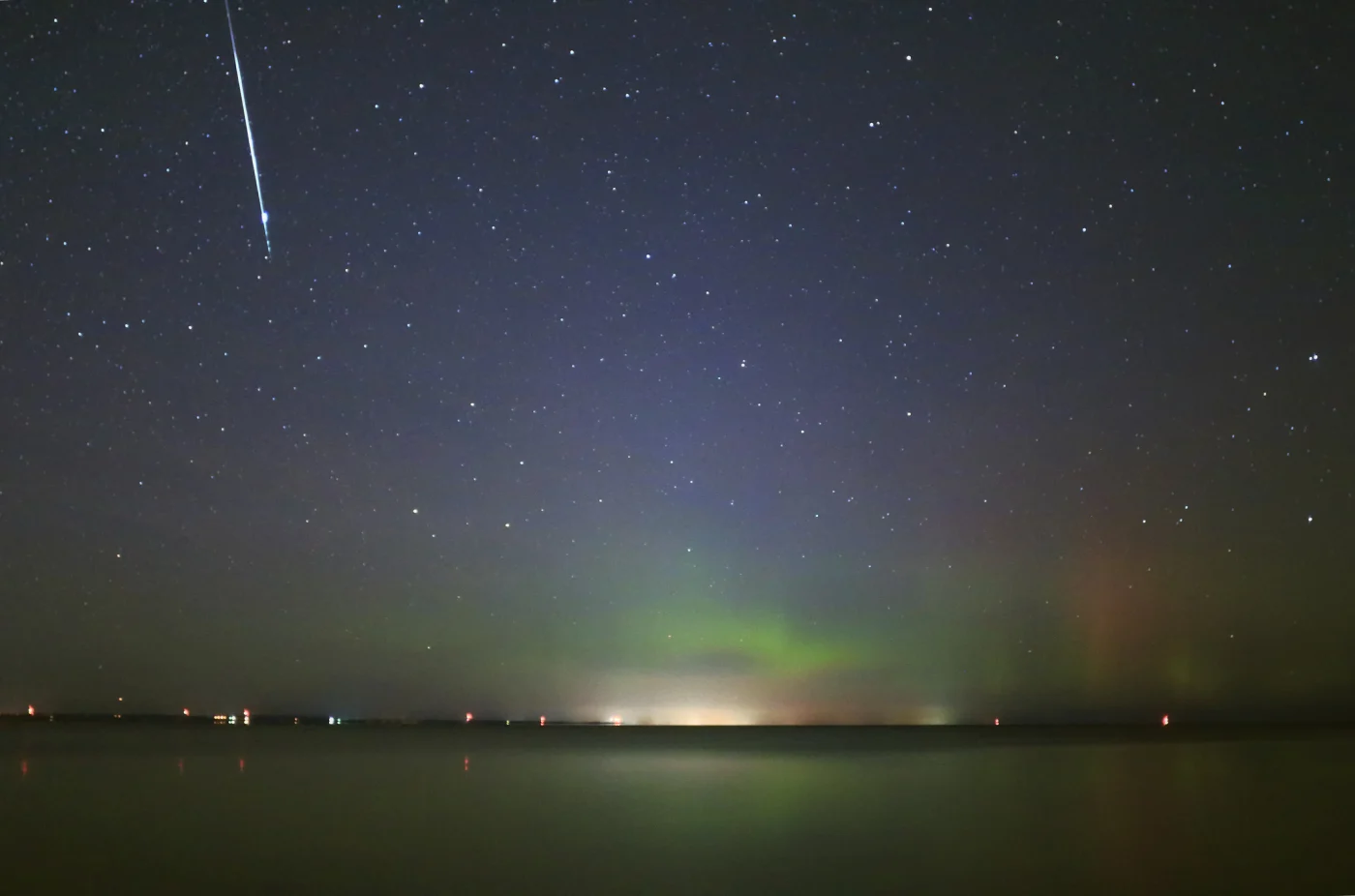 Taurid meteor over Lake Simcoe, Ontario, Canada. Credit: Orchidpoet / Getty Images