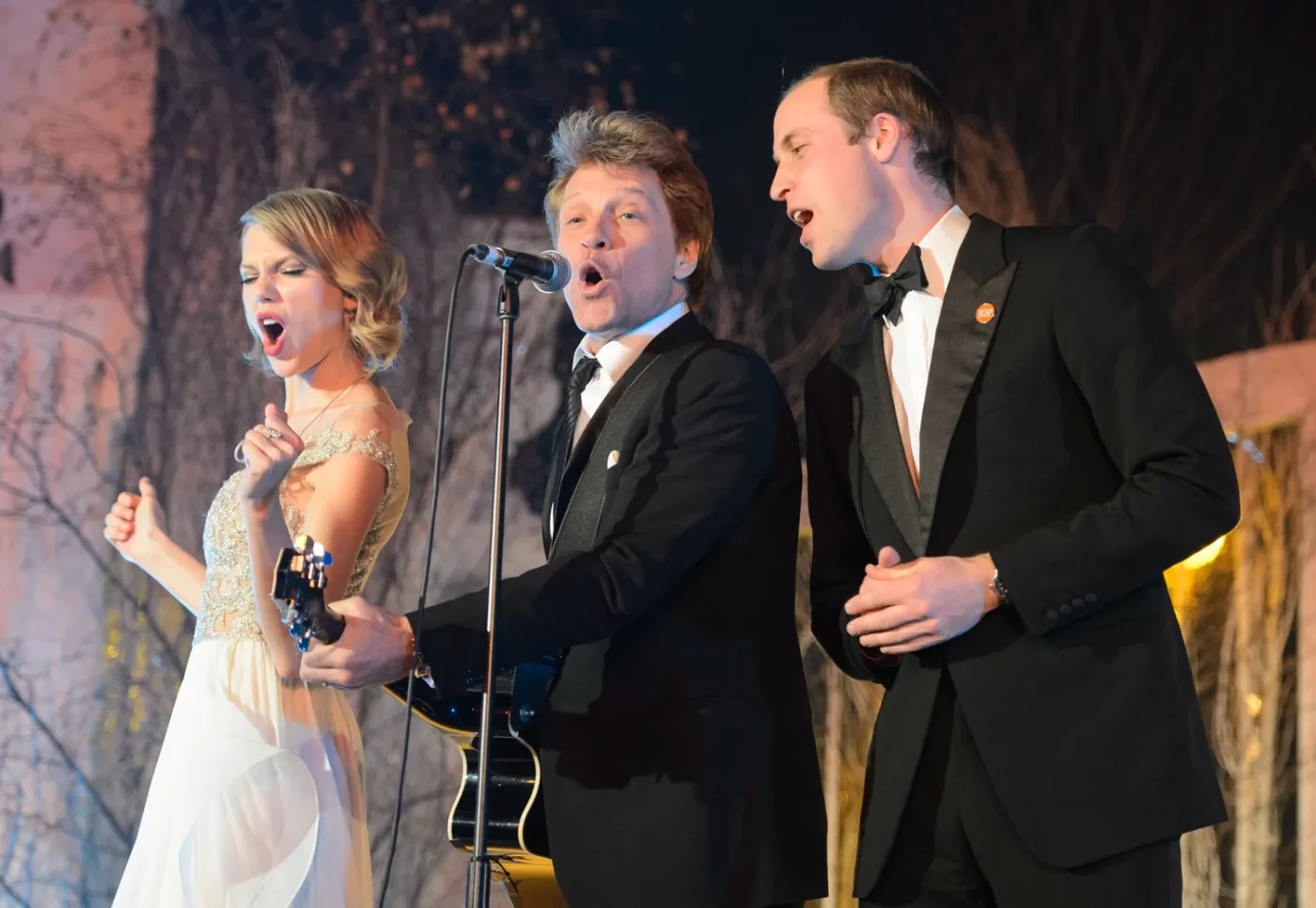 Taylor Swift, Jon Bon Jovi, and Prince William onstage on November 26, 2013.