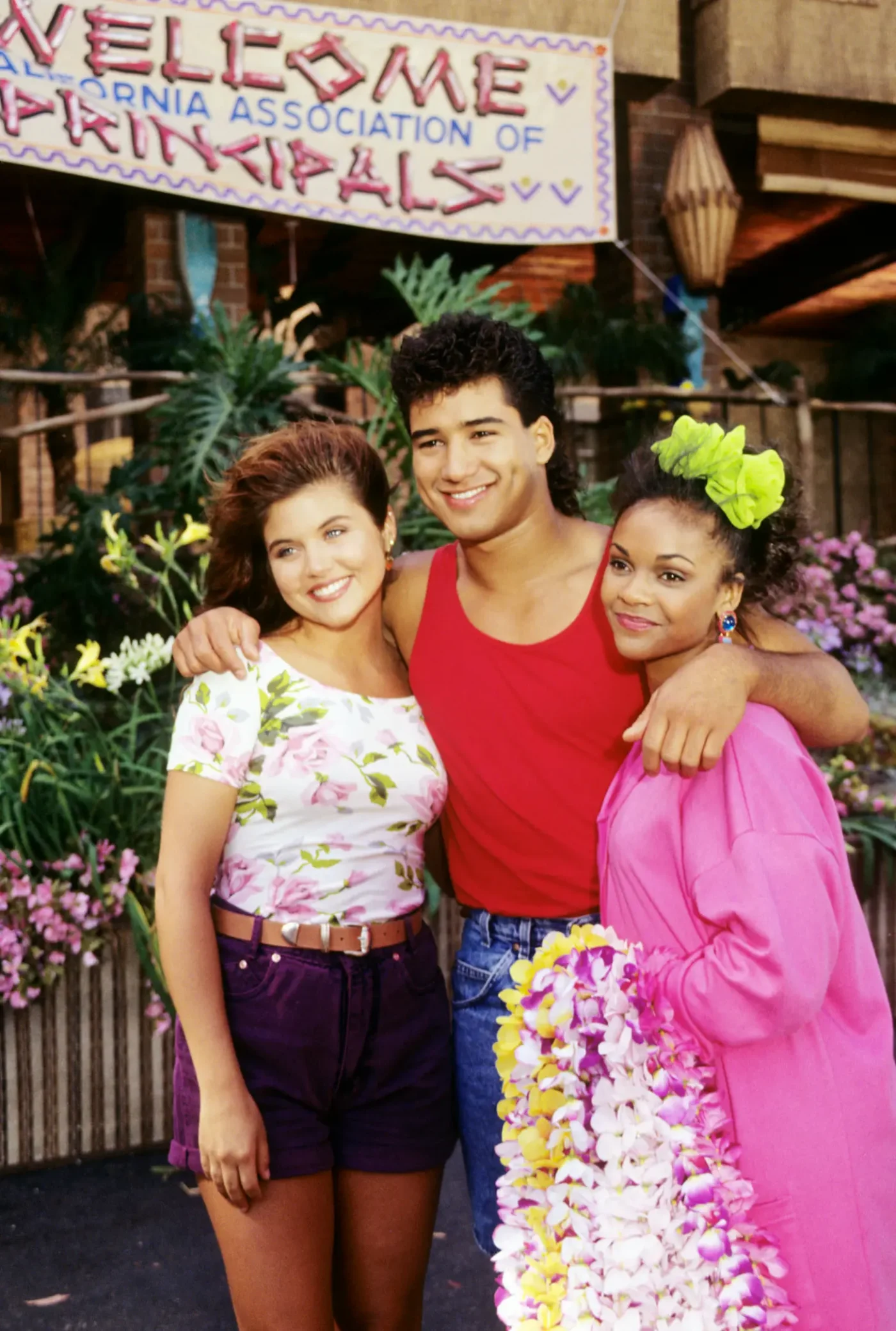 Tiffani-Amber Thiessen, Mario Lopez, and Lark Voorhies in Saved by the Bell: Hawaiian Style.