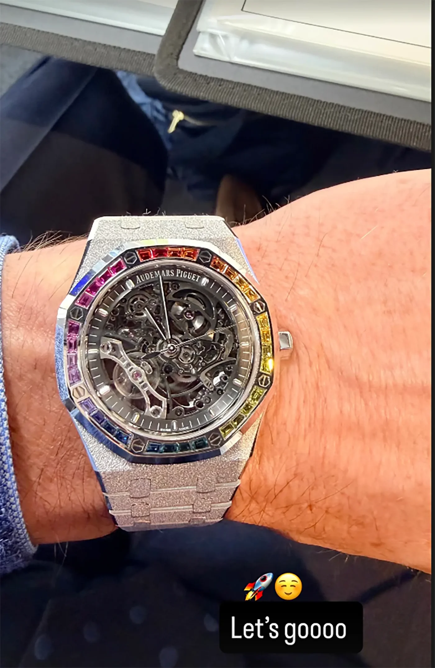 Tom Brady wearing a diamond and gemstone-encrusted Audemars Piguet watch.