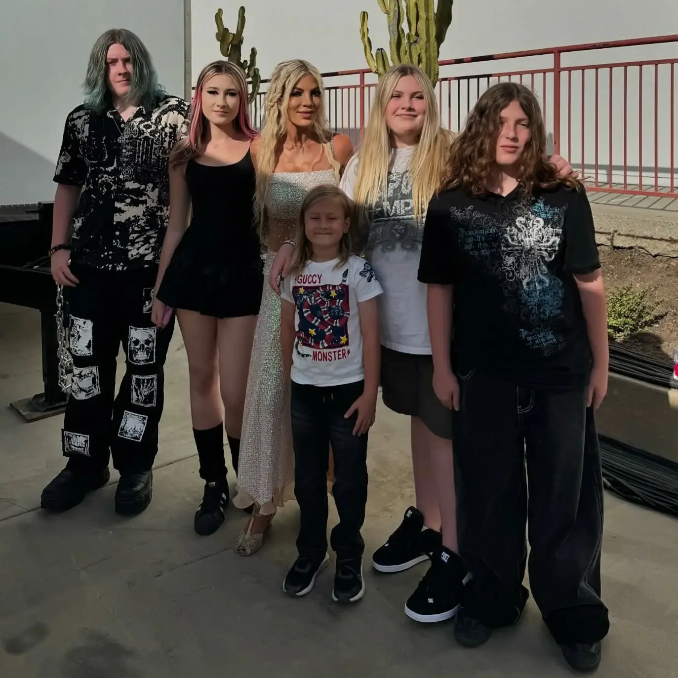Tori Spelling with her five kids outdoors.