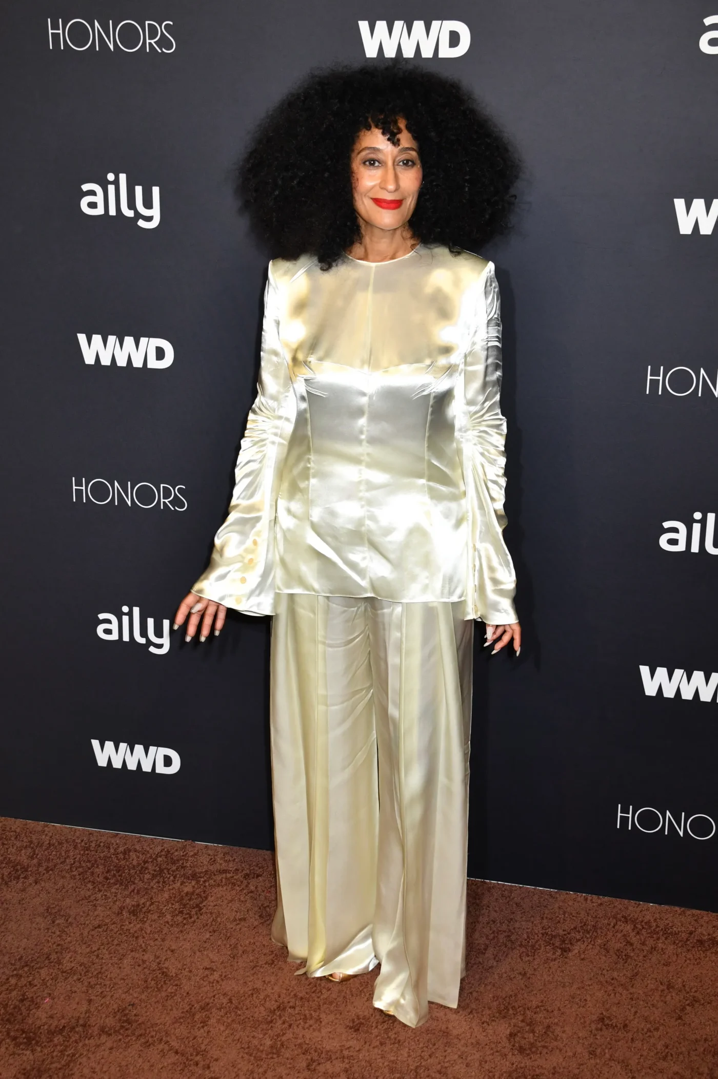 Tracee Ellis Ross poses on the red carpet at the 2026 WWD Honors in New York City.