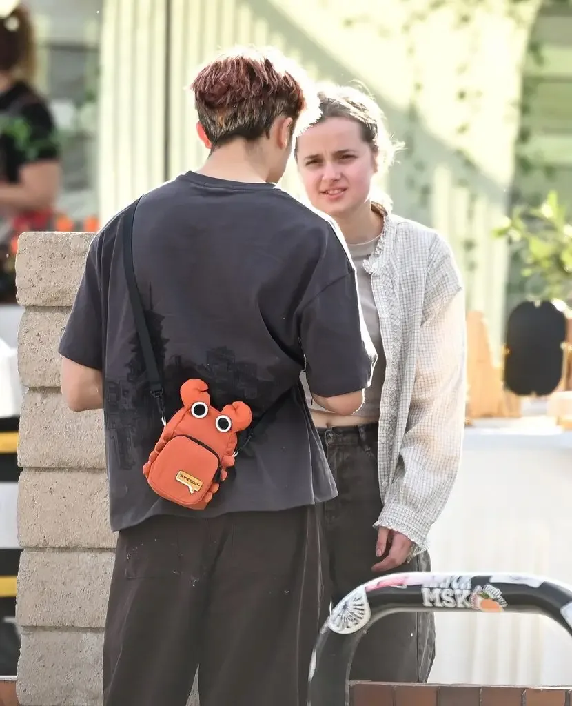 Vivienne Jolie and Knox Jolie are seen sharing a sweet moment together outside of an event where Vivienne was selling artwork